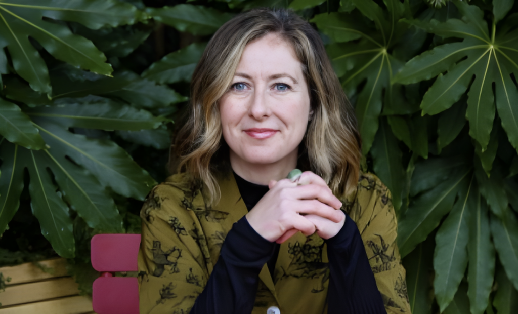 Sarah Chambers, seated outdoors